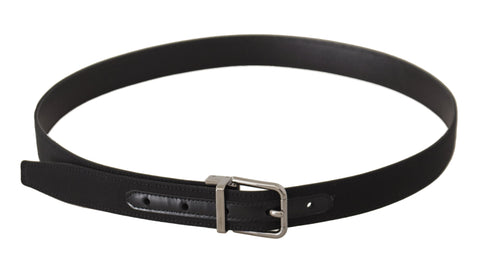Black canvas and leather belt with silver metal buckle from Dolce & Gabbana, featuring a sleek, stylish design.