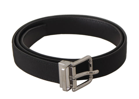 Black canvas leather belt with silver metal buckle by Dolce & Gabbana, showcasing its sleek design and high-quality craftsmanship.