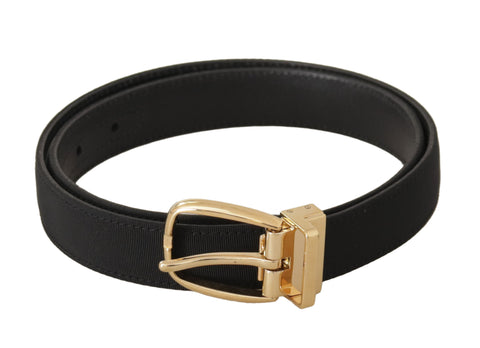 Black canvas and leather belt with gold metal buckle, stylish Dolce & Gabbana accessory for men or women.