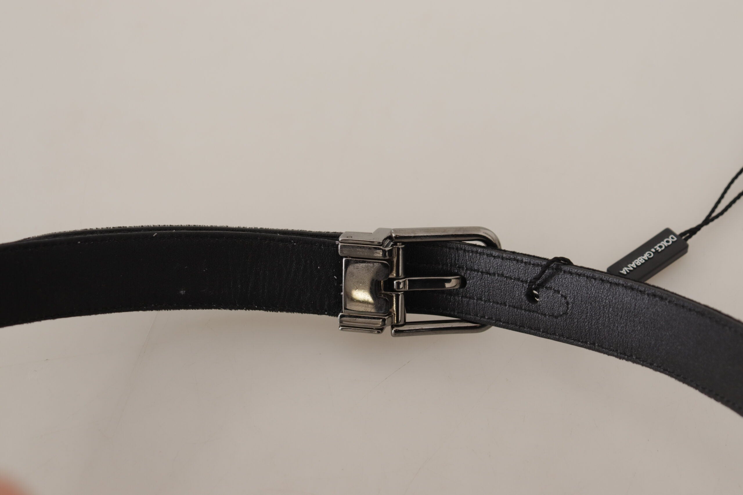 Black cotton belt with silver-tone metal buckle by Dolce & Gabbana, featuring a sleek and stylish design.