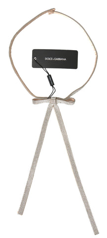 Beige silk waist belt with clear crystal bow detail by Dolce & Gabbana, stylish accessory for elegant outfits.