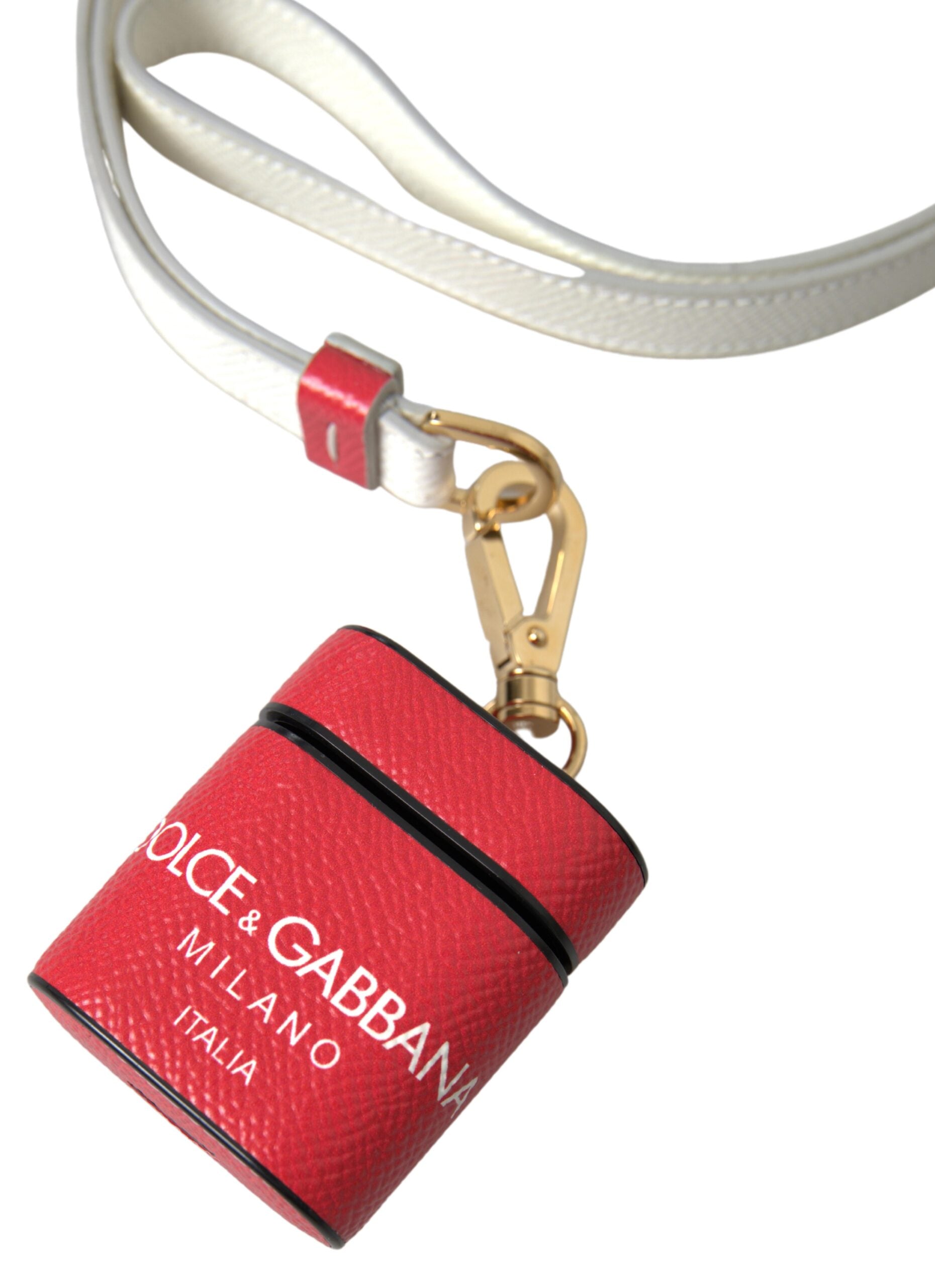 Red leather AirPods case with gold-tone metal logo print and strap, designed by Dolce & Gabbana.