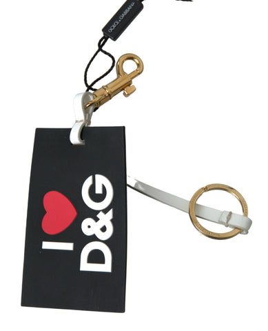 Black silicone Dolce & Gabbana keychain with gold brass DG logo and keyring attachment.