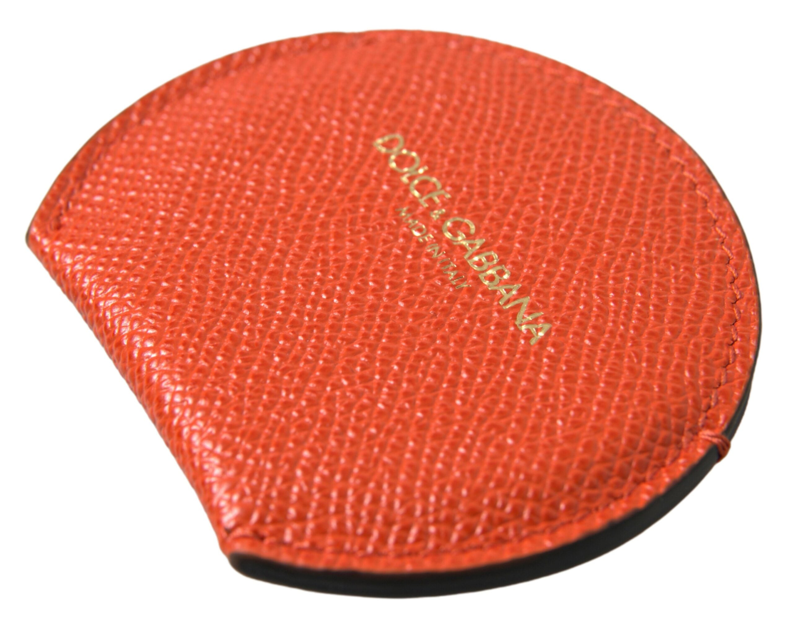 Orange calfskin leather round logo hand mirror holder by Dolce & Gabbana, featuring a sleek design and embossed logo detail.