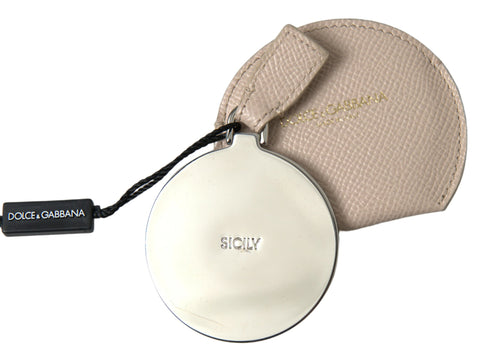Beige calfskin leather Dolce & Gabbana round logo hand mirror holder with sleek design and embossed logo detail.