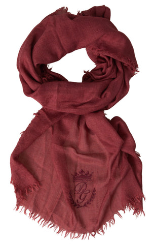 Maroon cashmere knit wrap shawl with fringe detail from Dolce & Gabbana, styled as a cozy and elegant accessory.
