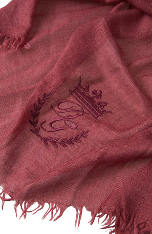 Maroon cashmere knit wrap shawl with fringe detailing by Dolce & Gabbana, draped and styled for a cozy, elegant look.