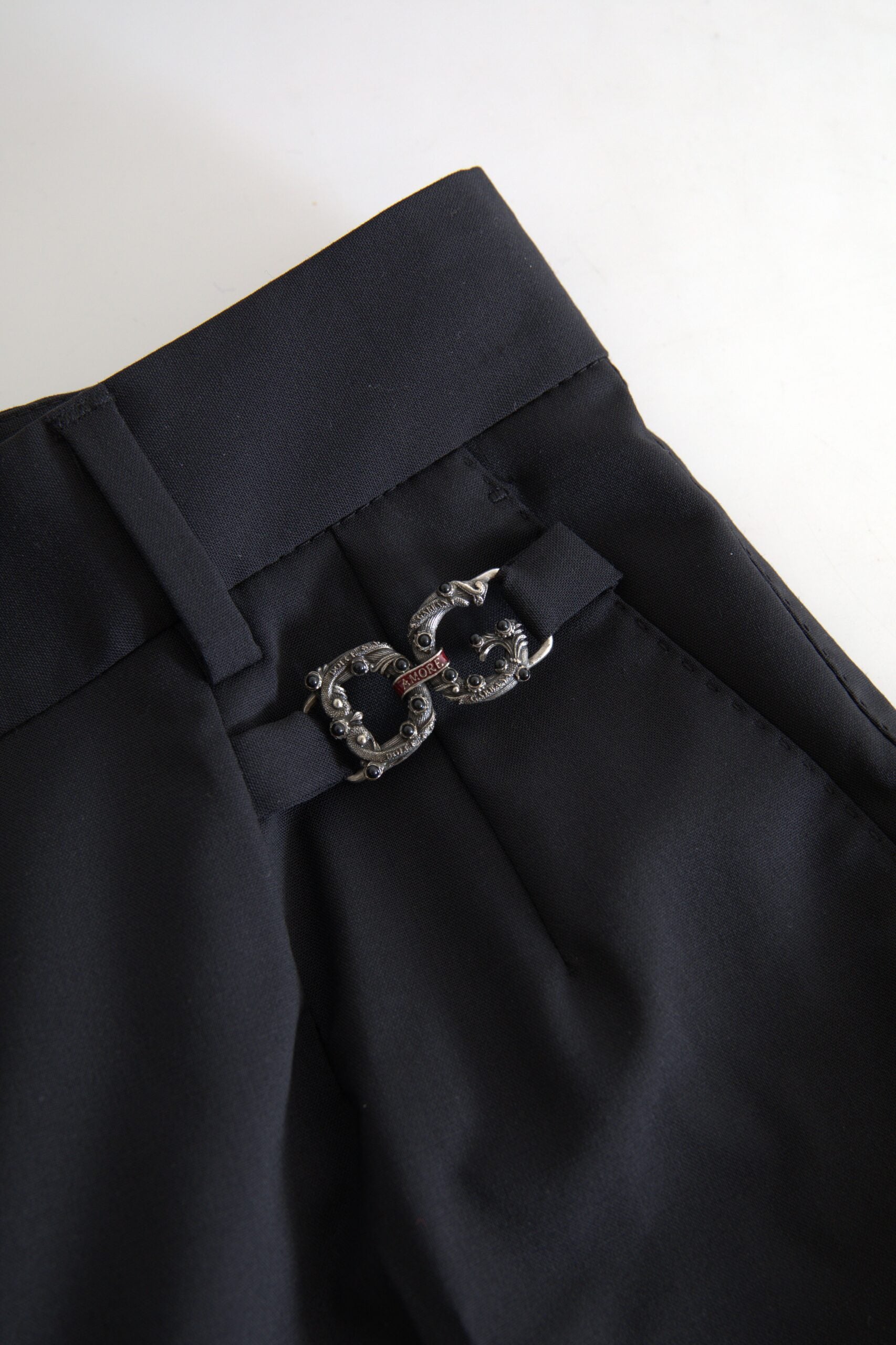 Black wool high waist tapered pants by Dolce & Gabbana, featuring a sleek fit and tailored design.