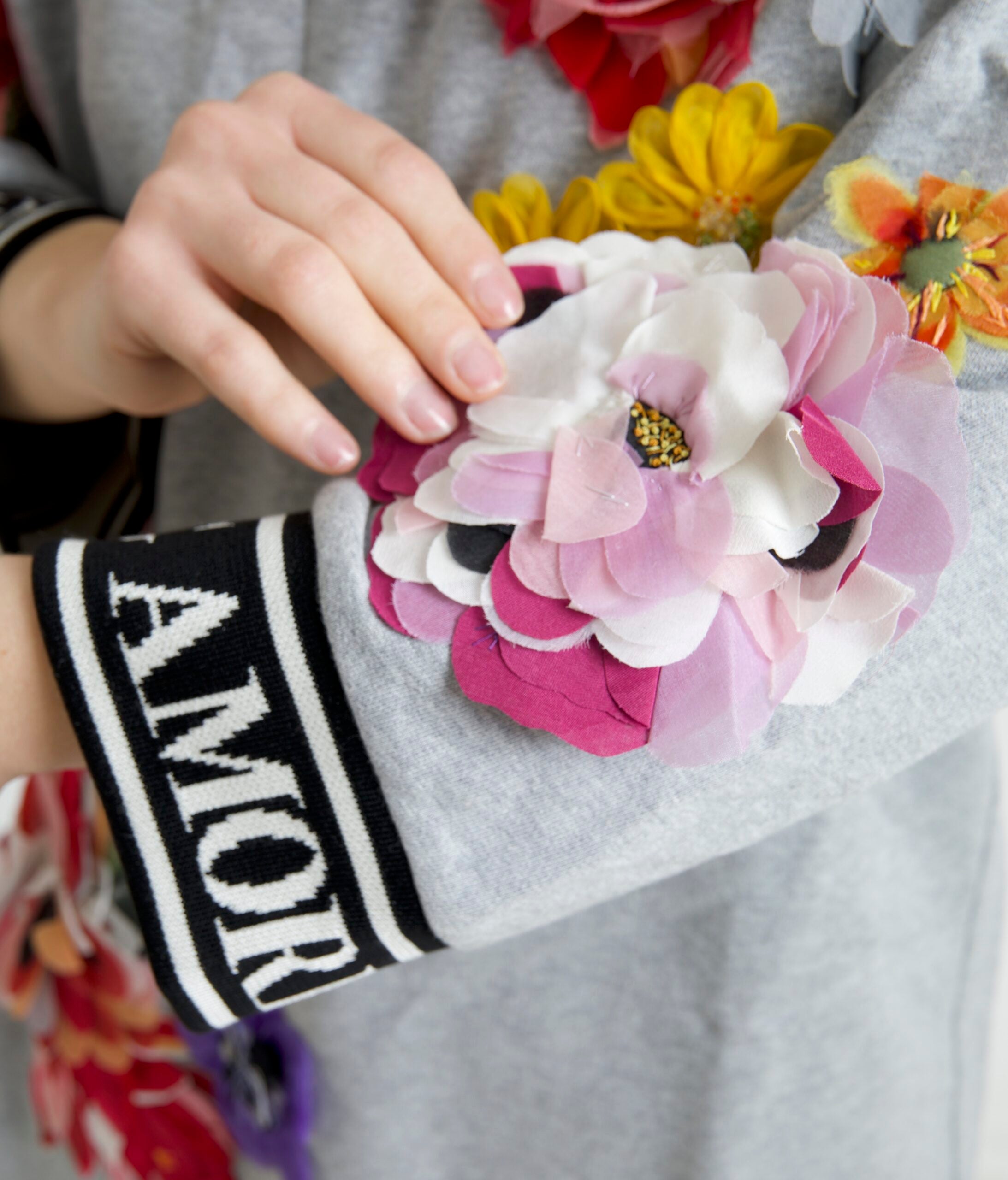 Gray Dolce & Gabbana Amore Queen floral pullover sweater with a floral pattern and cozy knit fabric.