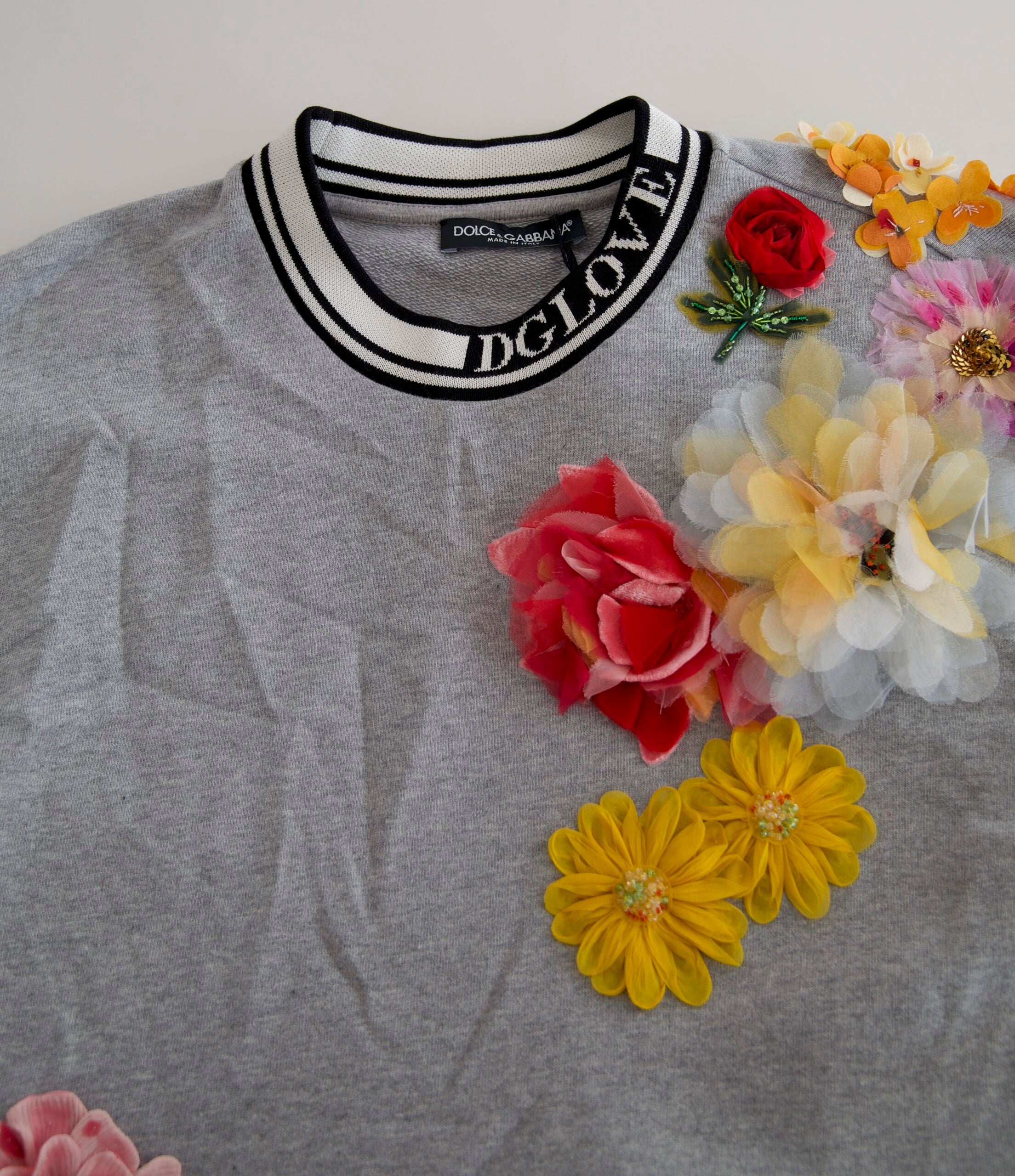 Gray Dolce & Gabbana Amore Queen floral pullover sweater with a floral pattern and relaxed fit, shown on a model.