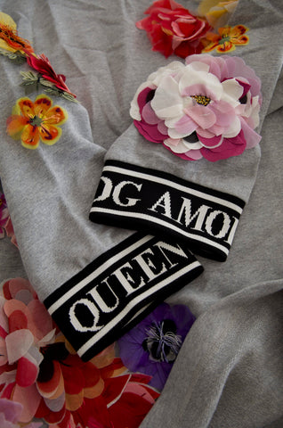 Gray Dolce & Gabbana Amore Queen floral pullover sweater with floral pattern and ribbed cuffs.