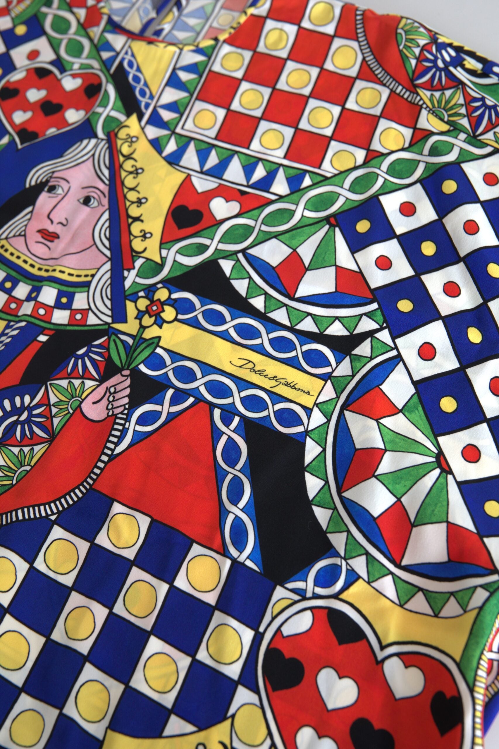 Multicolor printed long-sleeve blouse top by Dolce & Gabbana, featuring vibrant patterns and elegant design.