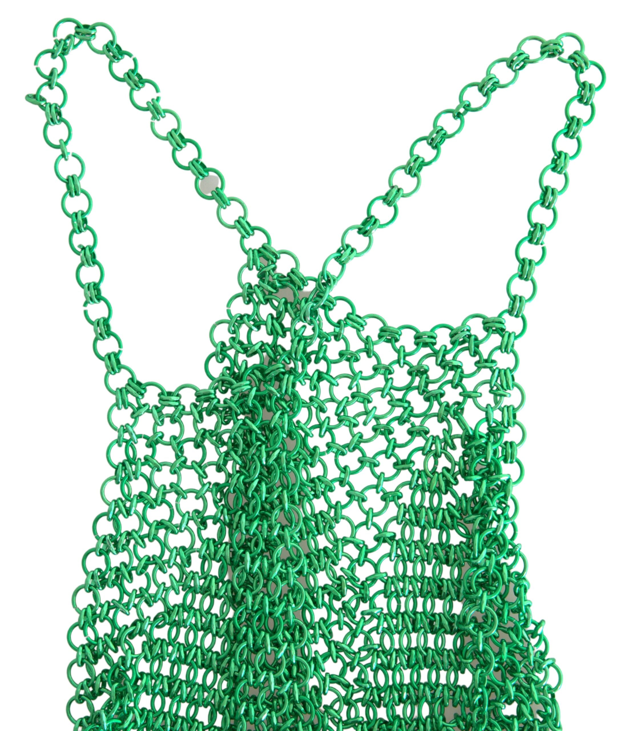 Green aluminum sleeveless halter cropped tank top by Dolce & Gabbana, showing its fitted design and sleek fabric texture.