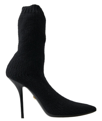 Black stiletto heel mid-calf women's boot shoes by Dolce & Gabbana, featuring sleek design and pointed toe.