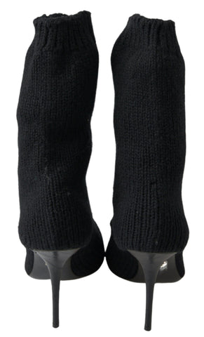 Black Dolce & Gabbana stiletto heel mid-calf women's boot shoes with sleek design and pointed toe, shown on a white background.