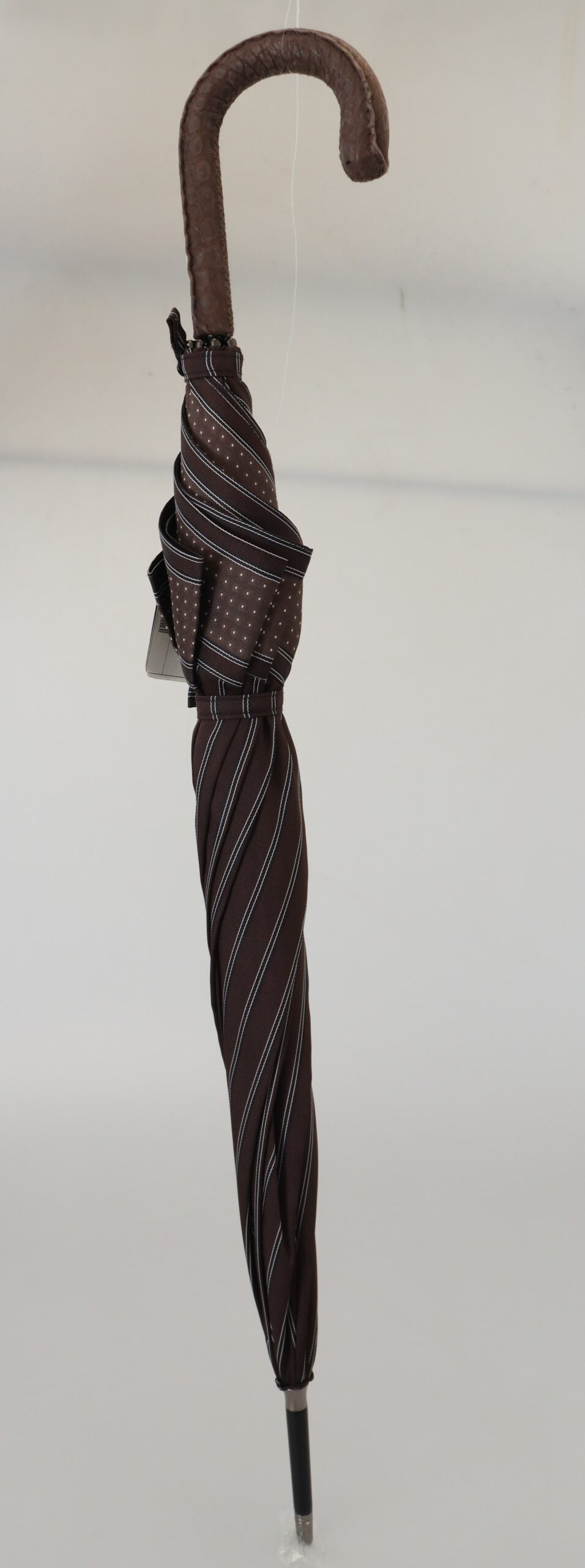 Brown striped leather handle collapsible umbrella by Dolce & Gabbana with a sleek, stylish design.