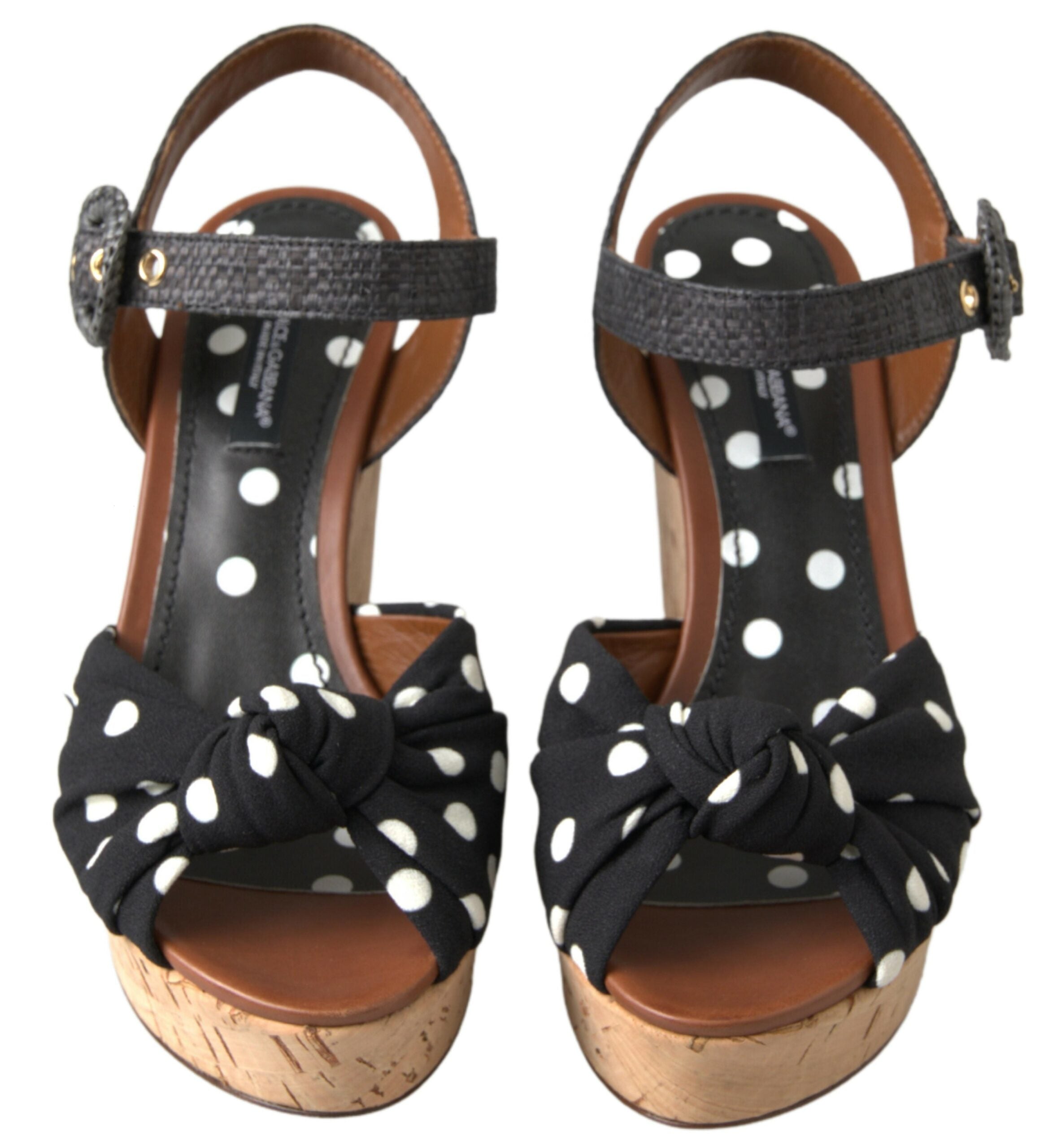 Black polka dot wedge sandals with ankle straps from Dolce & Gabbana, featuring a stylish and comfortable design.
