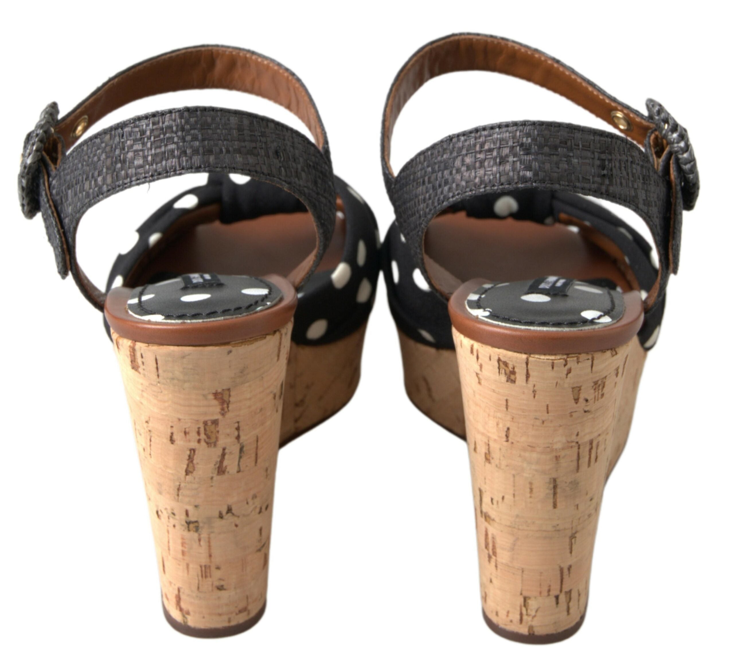 Black polka dotted wedge sandals with ankle strap from Dolce & Gabbana, featuring a stylish and comfortable design.