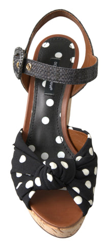 Black polka dotted ankle strap wedges sandals by Dolce & Gabbana with a chunky heel and stylish open-toe design.