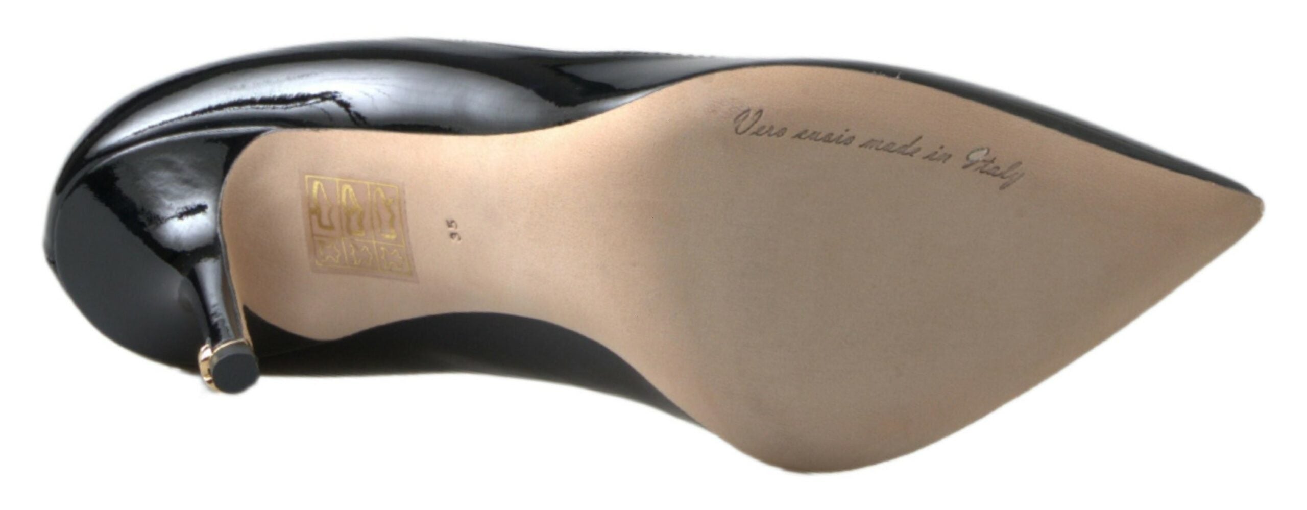Black patent leather high heels pumps by Dolce & Gabbana with pointed toes and sleek design.