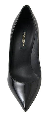 Black patent leather high heels pumps by Dolce & Gabbana, featuring a sleek pointed toe and elegant stiletto heel.