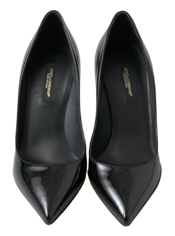 Black patent leather high heels pumps by Dolce & Gabbana, stylish women's footwear with sleek, shiny finish and pointed toe design.