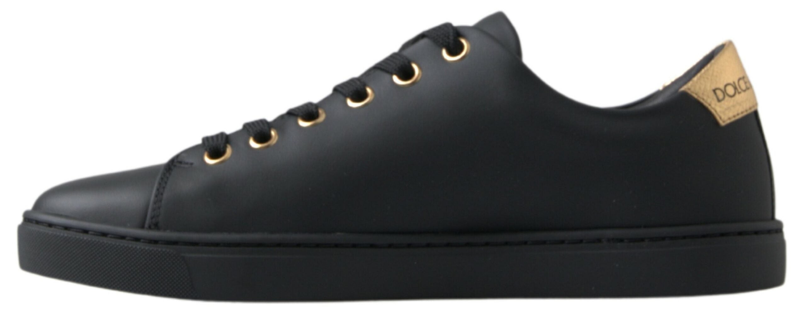 Black gold leather classic sneakers by Dolce & Gabbana, featuring stylish design and laces, on a clean white background.