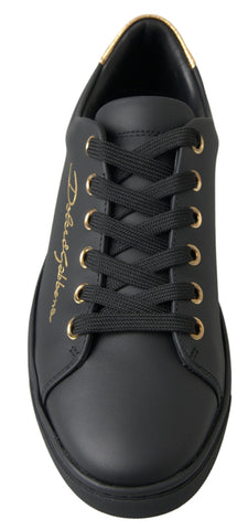 Black gold leather Dolce & Gabbana classic sneakers with sleek design and stylish detailing.