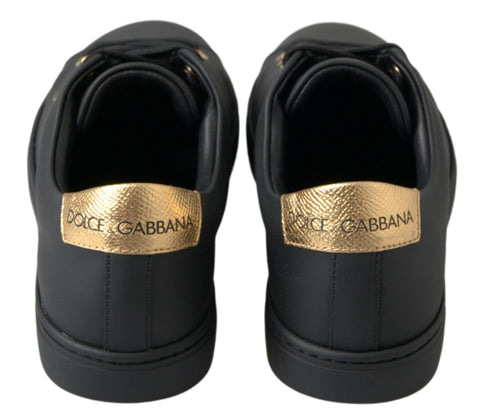 Black gold leather Dolce & Gabbana classic sneakers with stylish design and comfortable fit, shown in a close-up view.