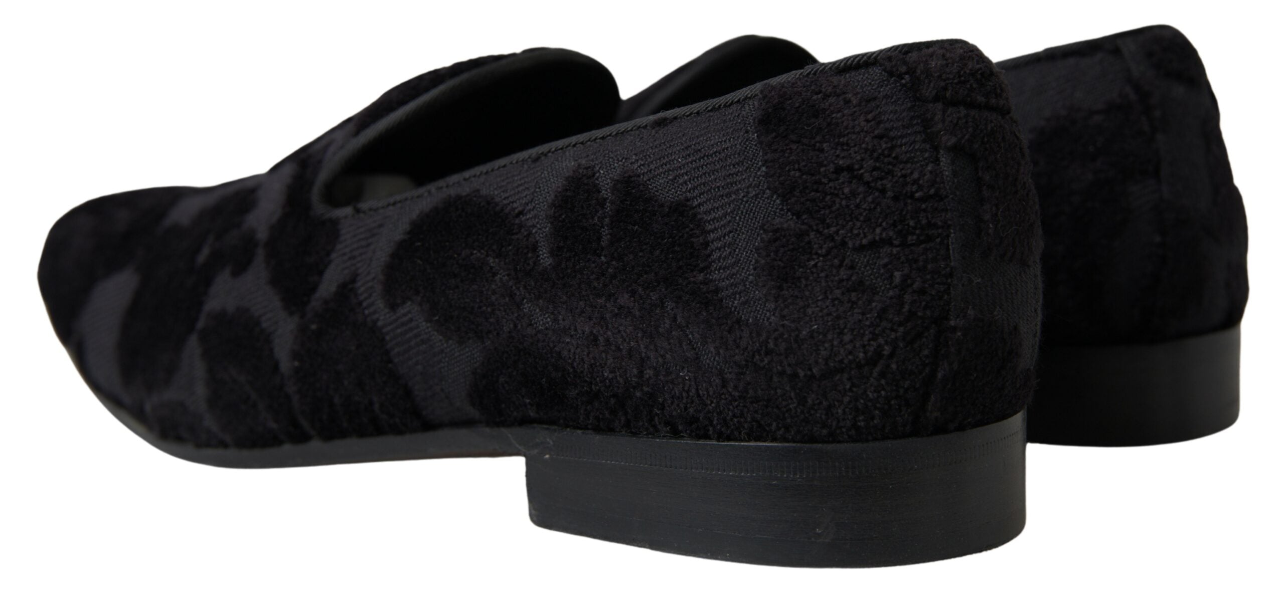 Black brocade loafers by Dolce & Gabbana, formal shoes with intricate pattern and sleek design, suitable for elegant occasions.