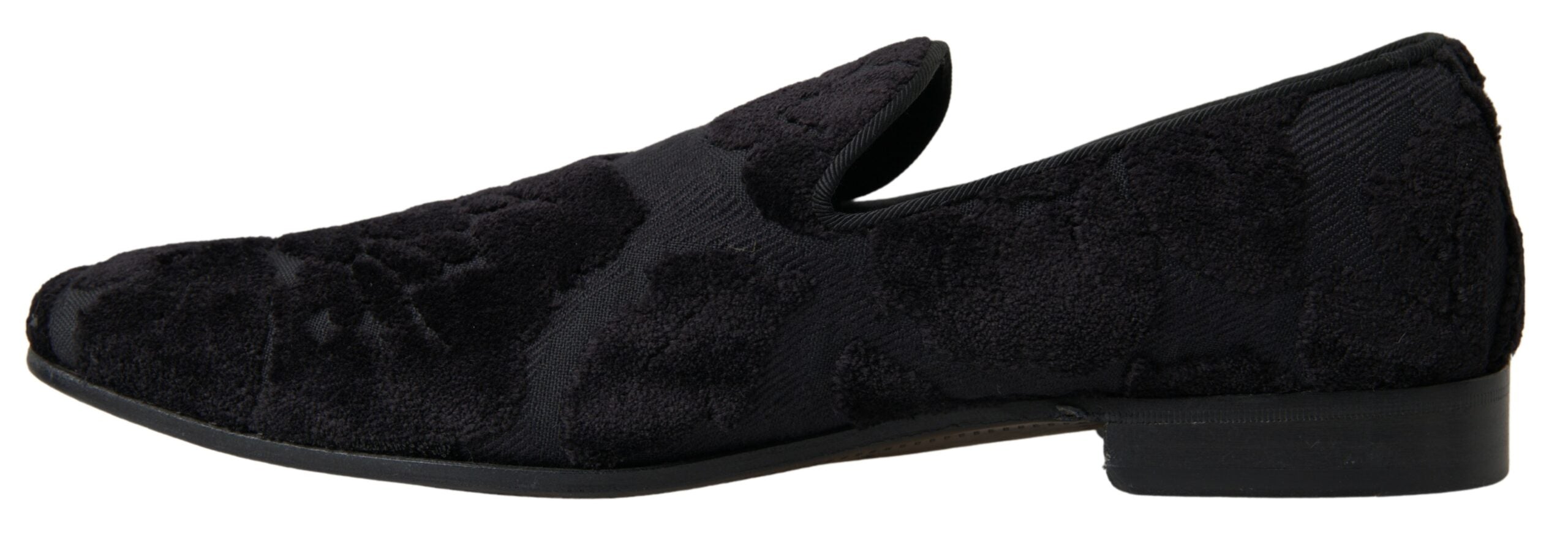 Black brocade loafers by Dolce & Gabbana with formal shoe design, featuring intricate fabric patterns and stylish slip-on style.