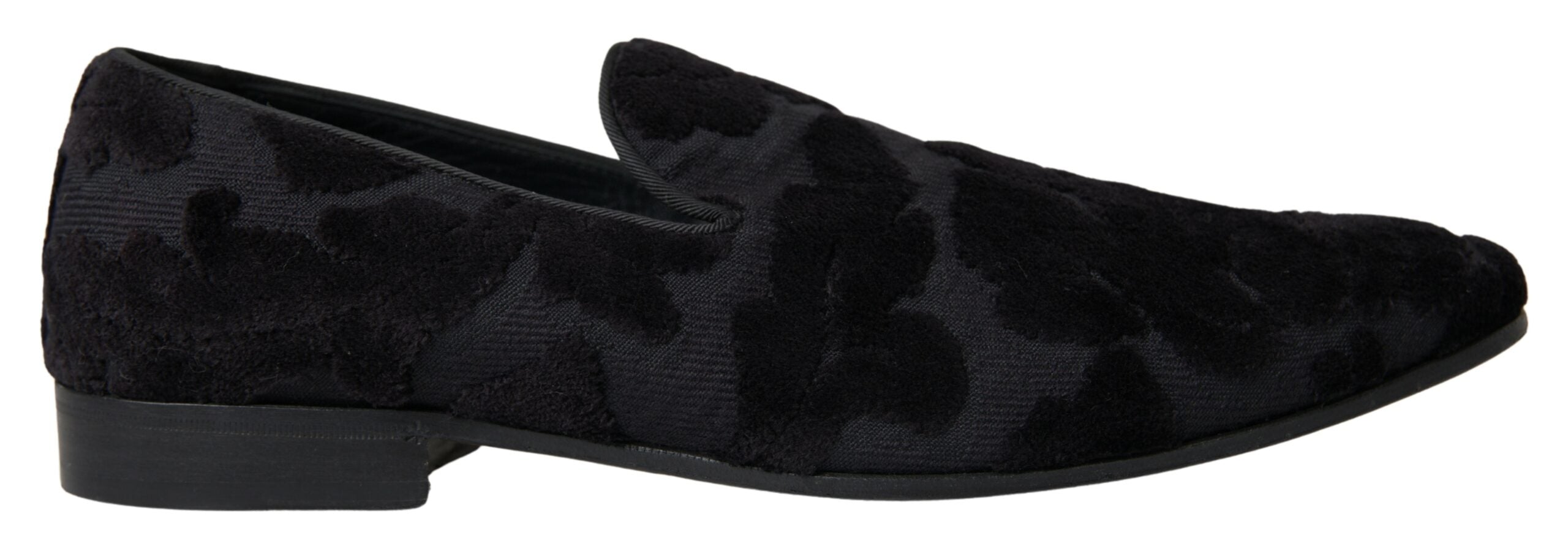 Black brocade loafers by Dolce & Gabbana, formal shoes with intricate fabric design, lace-up style, and classic silhouette.