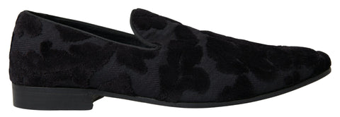 Black brocade loafers by Dolce & Gabbana, formal shoes with intricate fabric design, lace-up style, and classic silhouette.