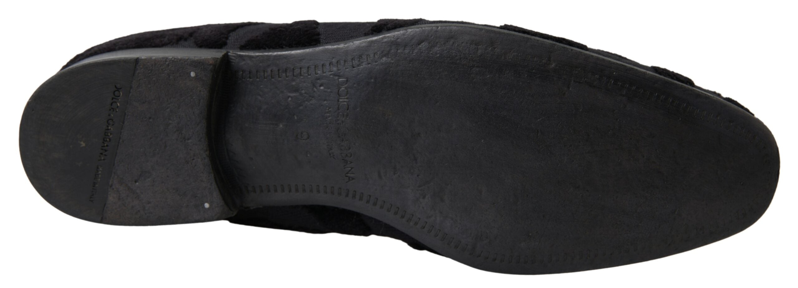 Black brocade loafers by Dolce & Gabbana, formal shoes with intricate brocade fabric and sleek design, suitable for elegant occasions.