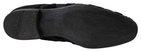 Black brocade loafers by Dolce & Gabbana, formal shoes with intricate brocade fabric and sleek design, suitable for elegant occasions.