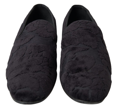 Black brocade loafers by Dolce & Gabbana featuring a formal shoe design with intricate pattern details.