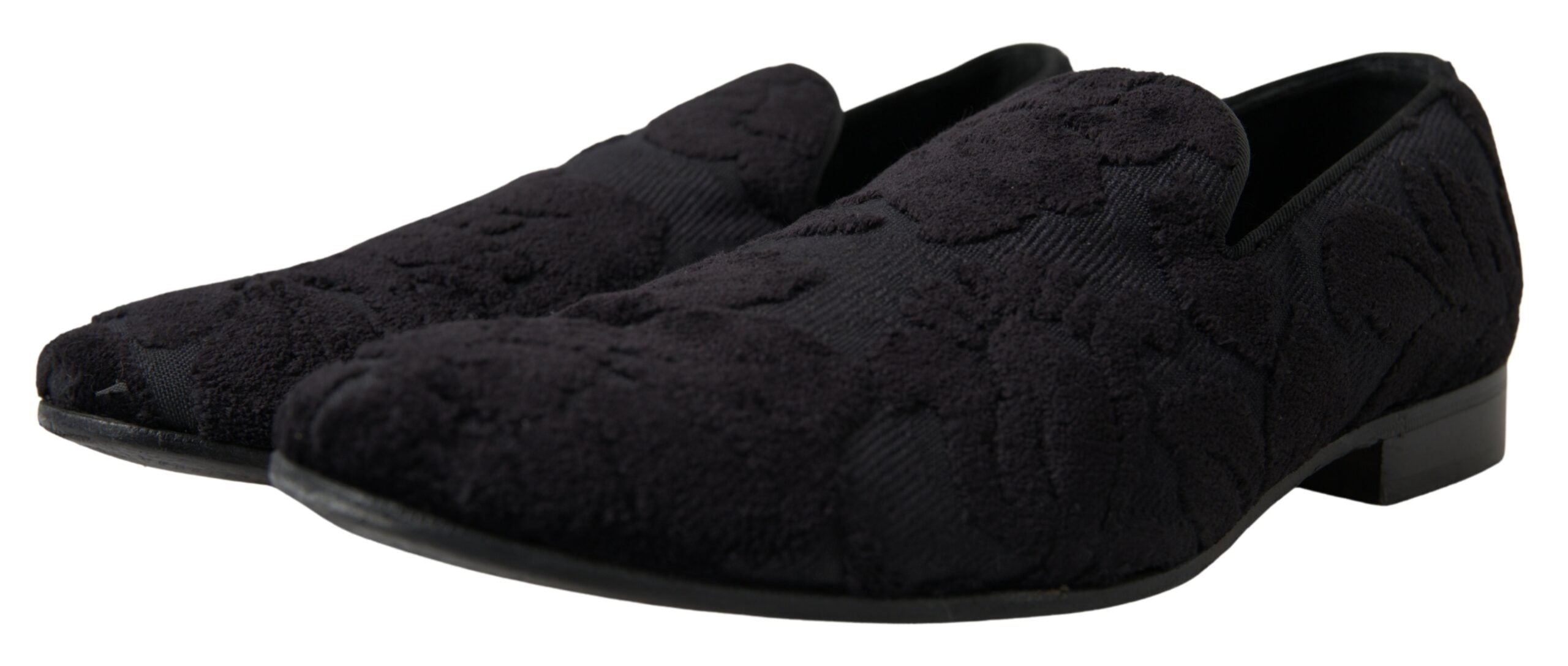 Black brocade loafers by Dolce & Gabbana, formal shoes with intricate fabric design and classic slip-on style.