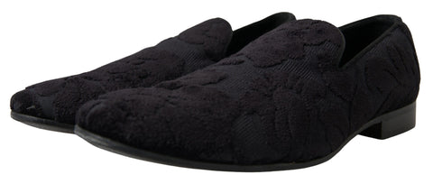 Black brocade loafers by Dolce & Gabbana, formal shoes with intricate fabric design and classic slip-on style.