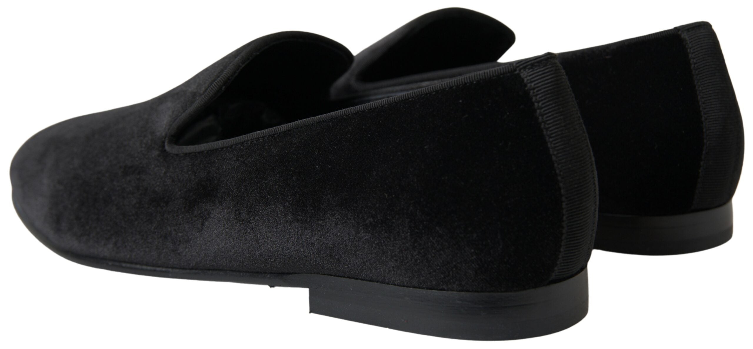 Black velvet loafers by Dolce & Gabbana, formal slip-on shoes with sleek design and polished finish.