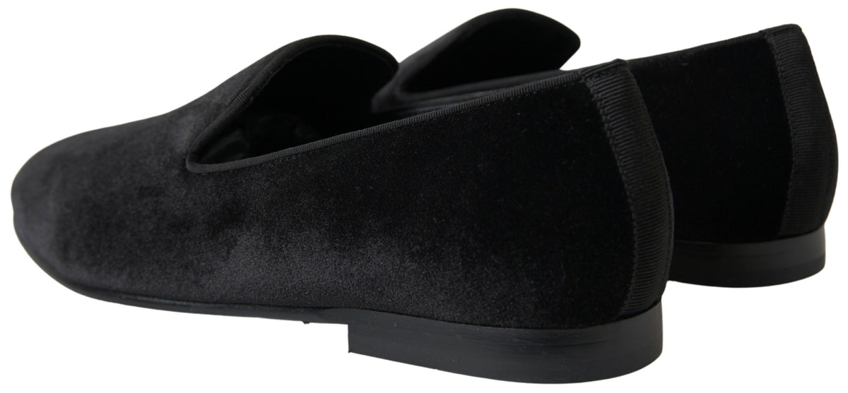 Black velvet loafers by Dolce & Gabbana, formal slip-on shoes with sleek design and polished finish.