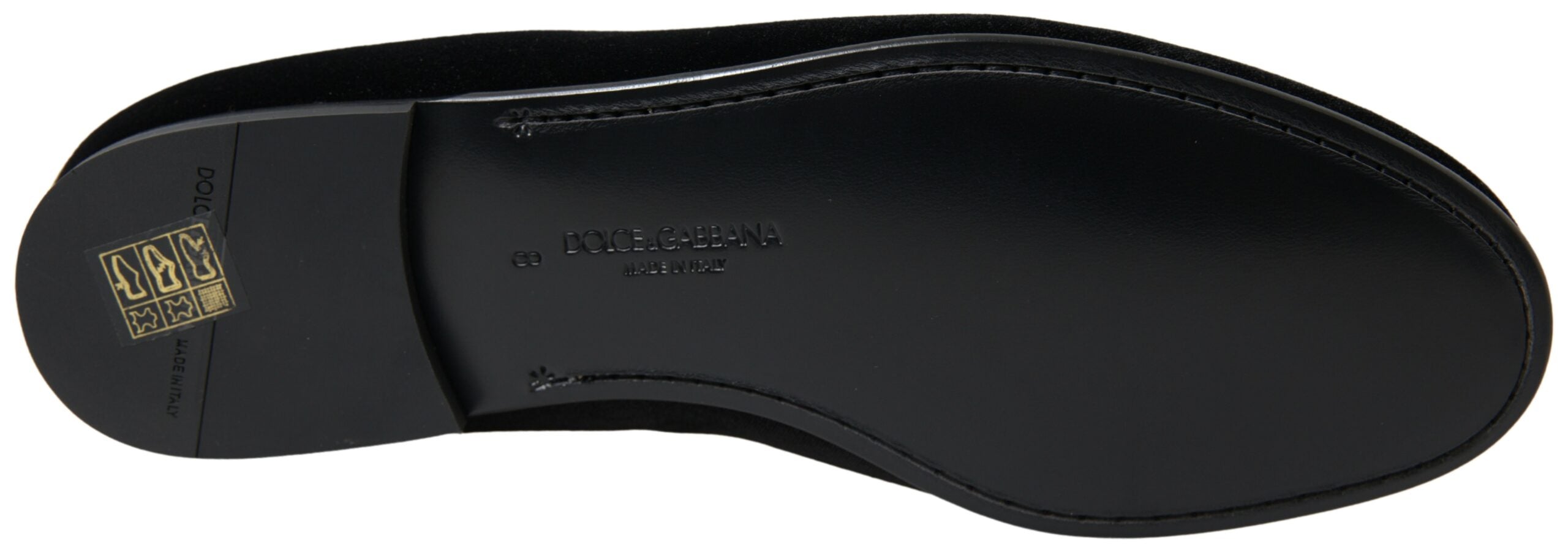 Black velvet loafers by Dolce & Gabbana, formal slip-on shoes with sleek design and polished finish.