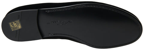 Black velvet loafers by Dolce & Gabbana, formal slip-on shoes with sleek design and polished finish.