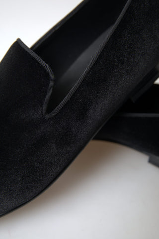 Black velvet loafers by Dolce & Gabbana, formal shoes with sleek design and refined craftsmanship, perfect for elegant occasions.