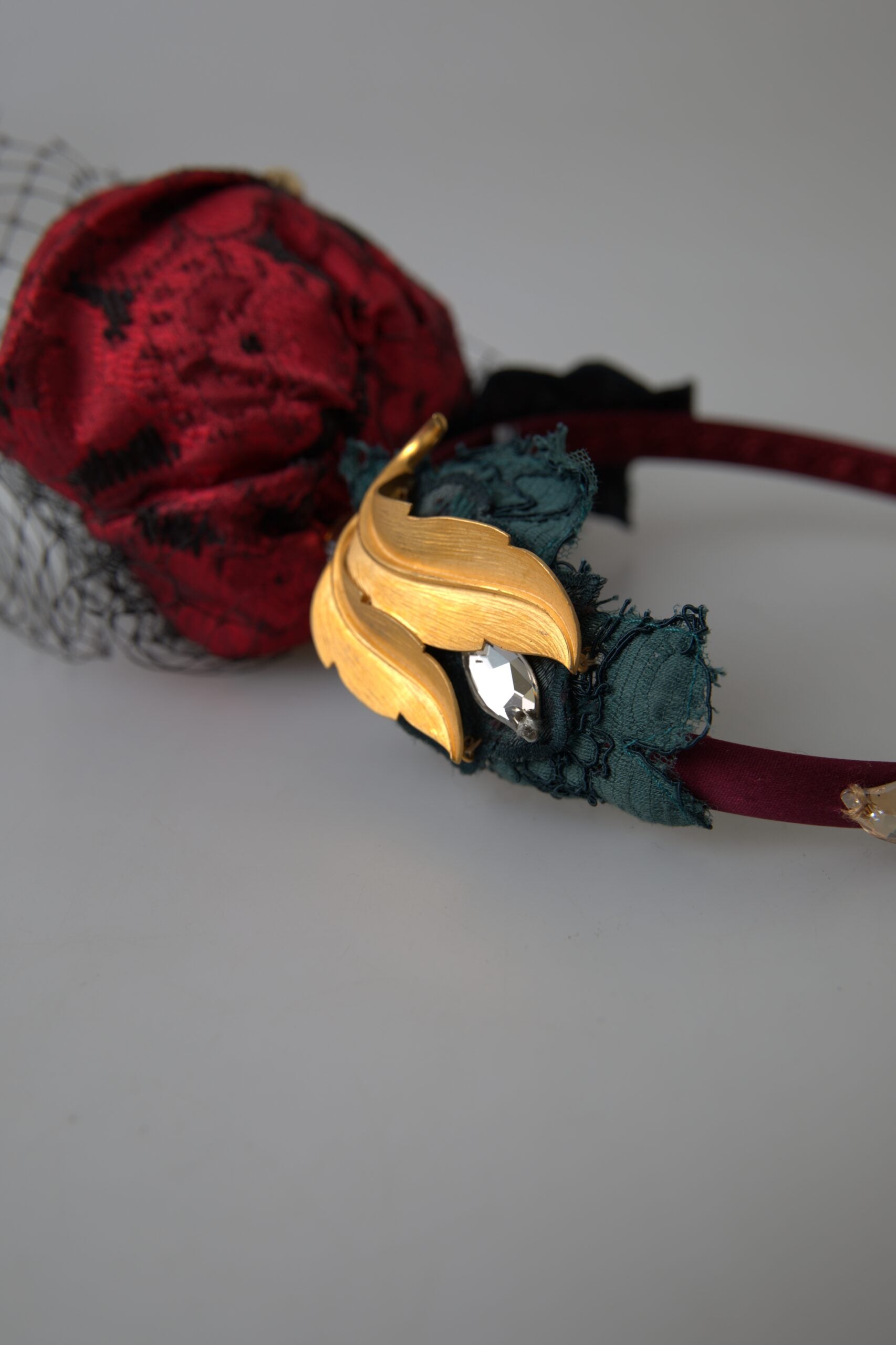 Red silk diadem headband with multicolor rose crystal netted logo, designed by Dolce & Gabbana.