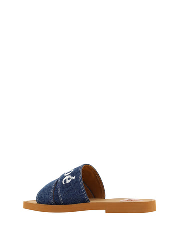 Chloé denim blue cotton slides with sandal straps and chunky soles, showcasing casual and stylish footwear.