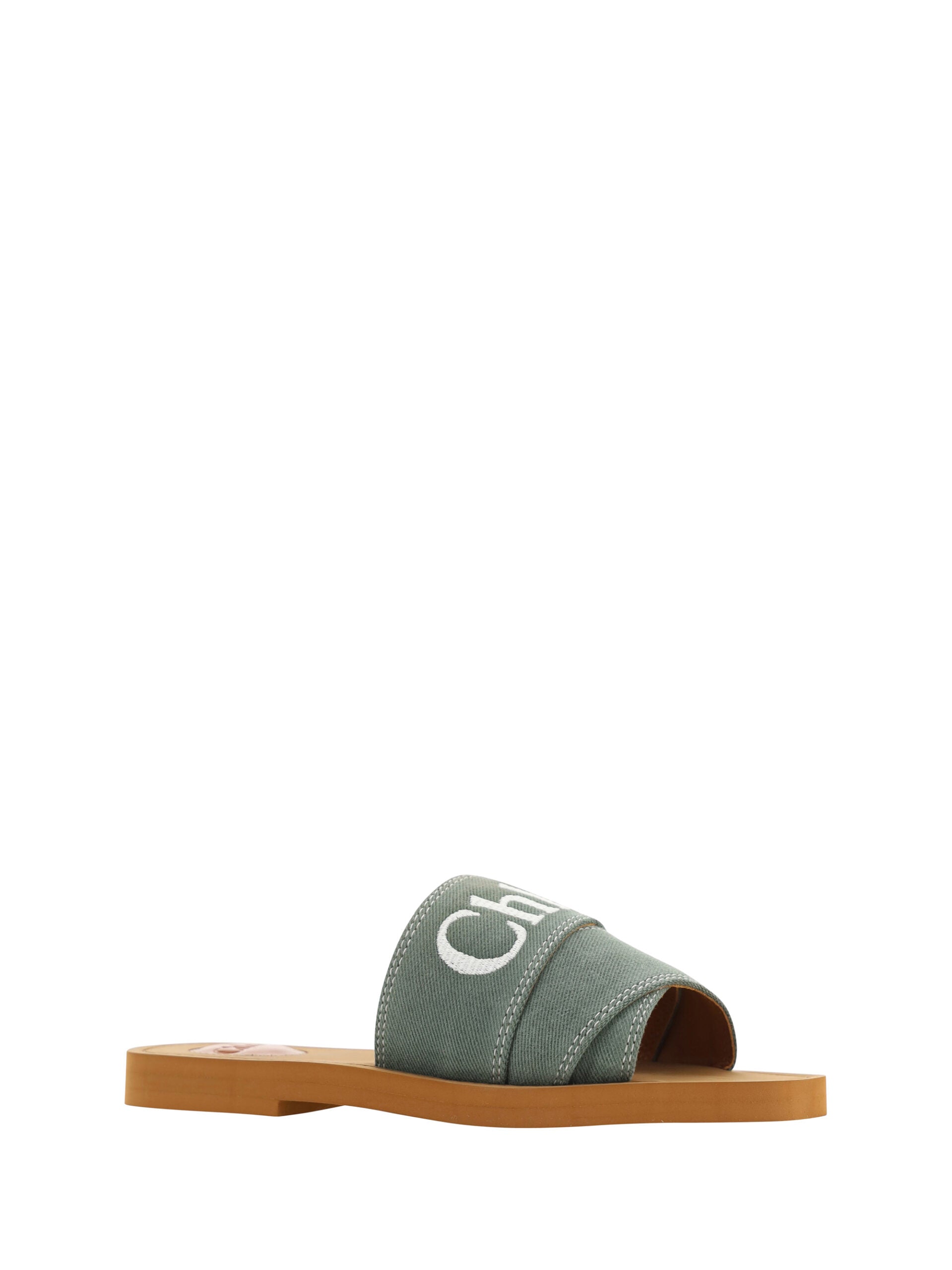 Forest green cotton slides by Chloé with woody sandal soles, featuring a casual slip-on design and comfortable open-toe style.