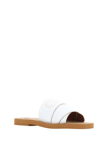 White cotton Chloé Woody Slides sandals with open toes and slip-on design, perfect for casual summer wear.