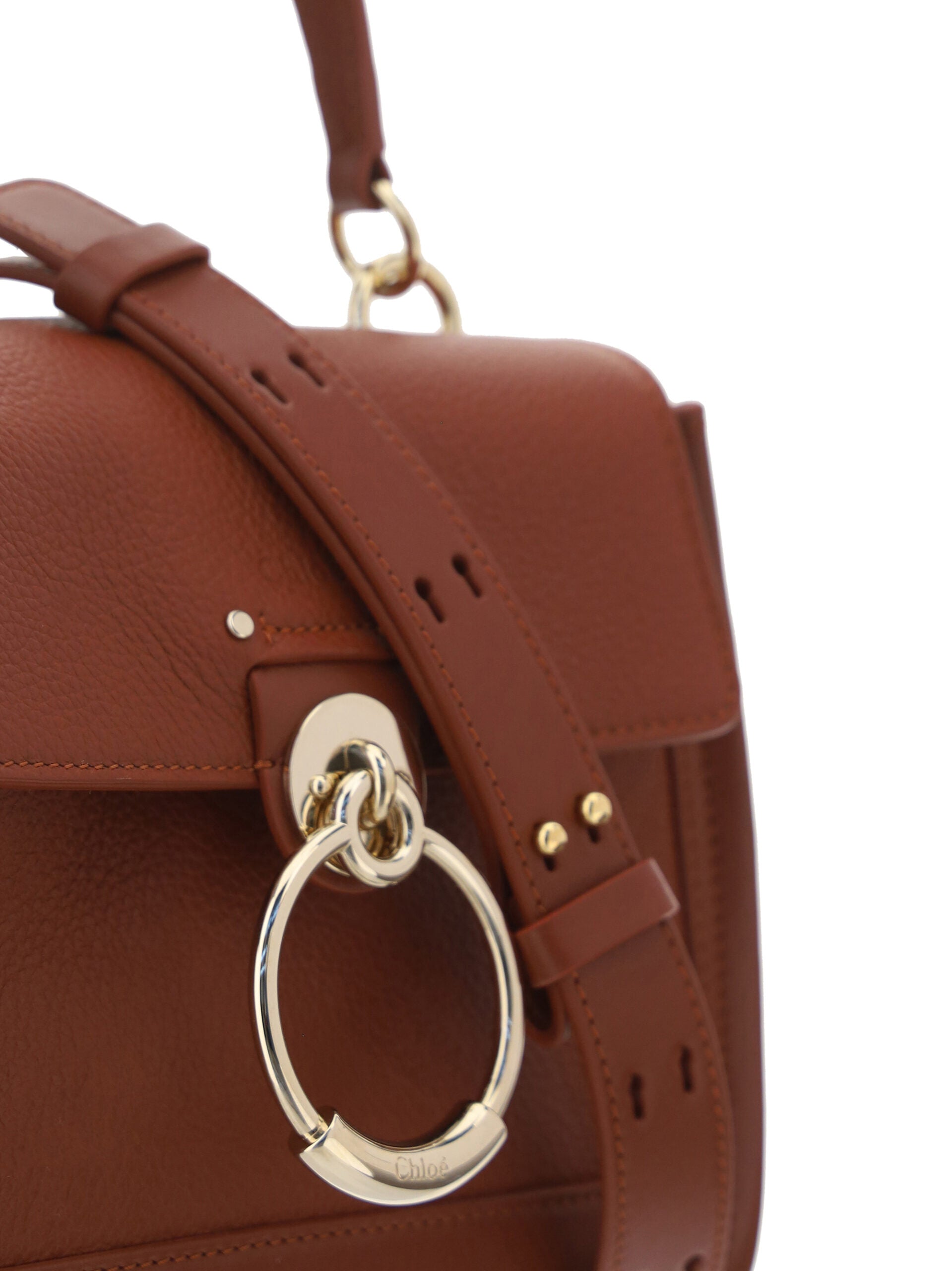 Chloé Tess handbag made of brown calf leather with gold-tone hardware and top handle, stylish and luxurious accessory.