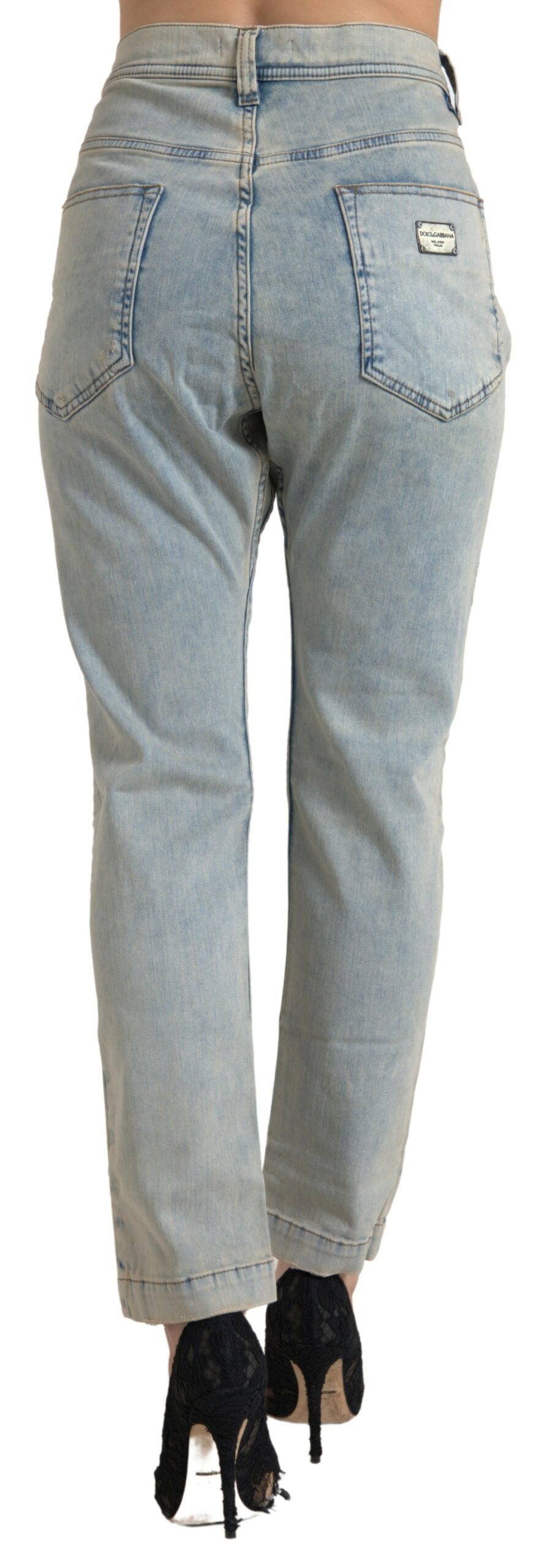 Blue washed cotton mid waist skinny jeans by Dolce & Gabbana, showing fitted style and classic denim details.