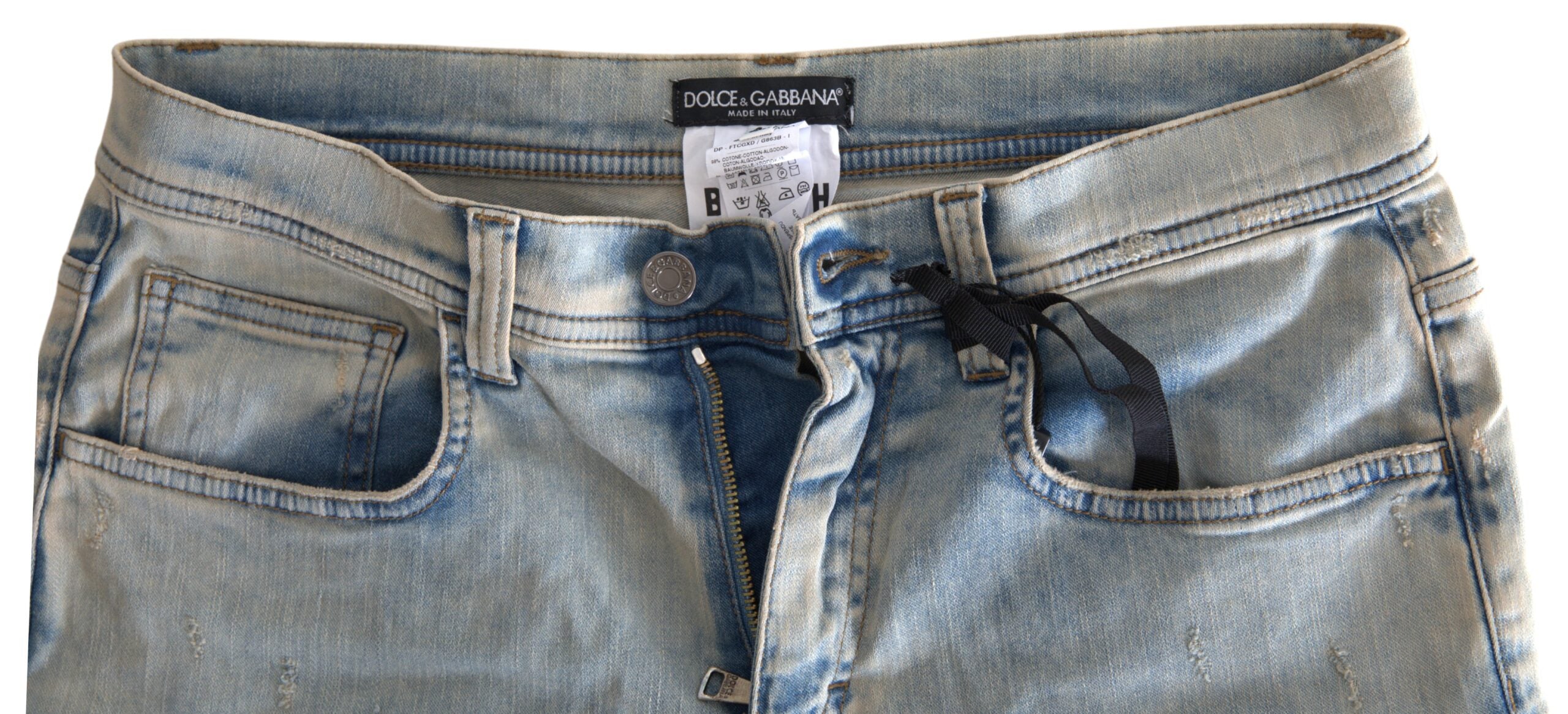 Blue washed cotton mid-waist skinny jeans by Dolce & Gabbana, showing the fitted denim with subtle fading and classic five-pocket design.